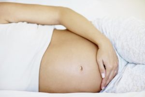Почему режет живот при беременности